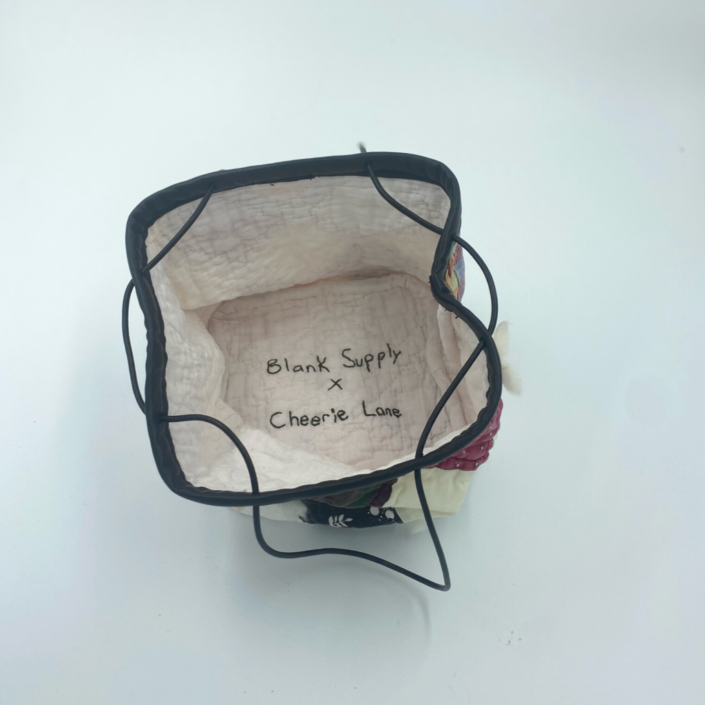 "Blank Supply x Cheerie Lane" stitched inside the handbag