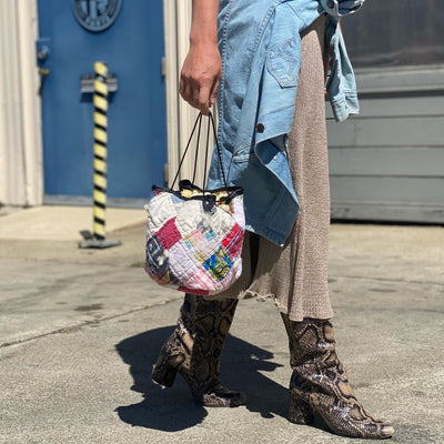 Woman walking with quilted cheerie lane purse