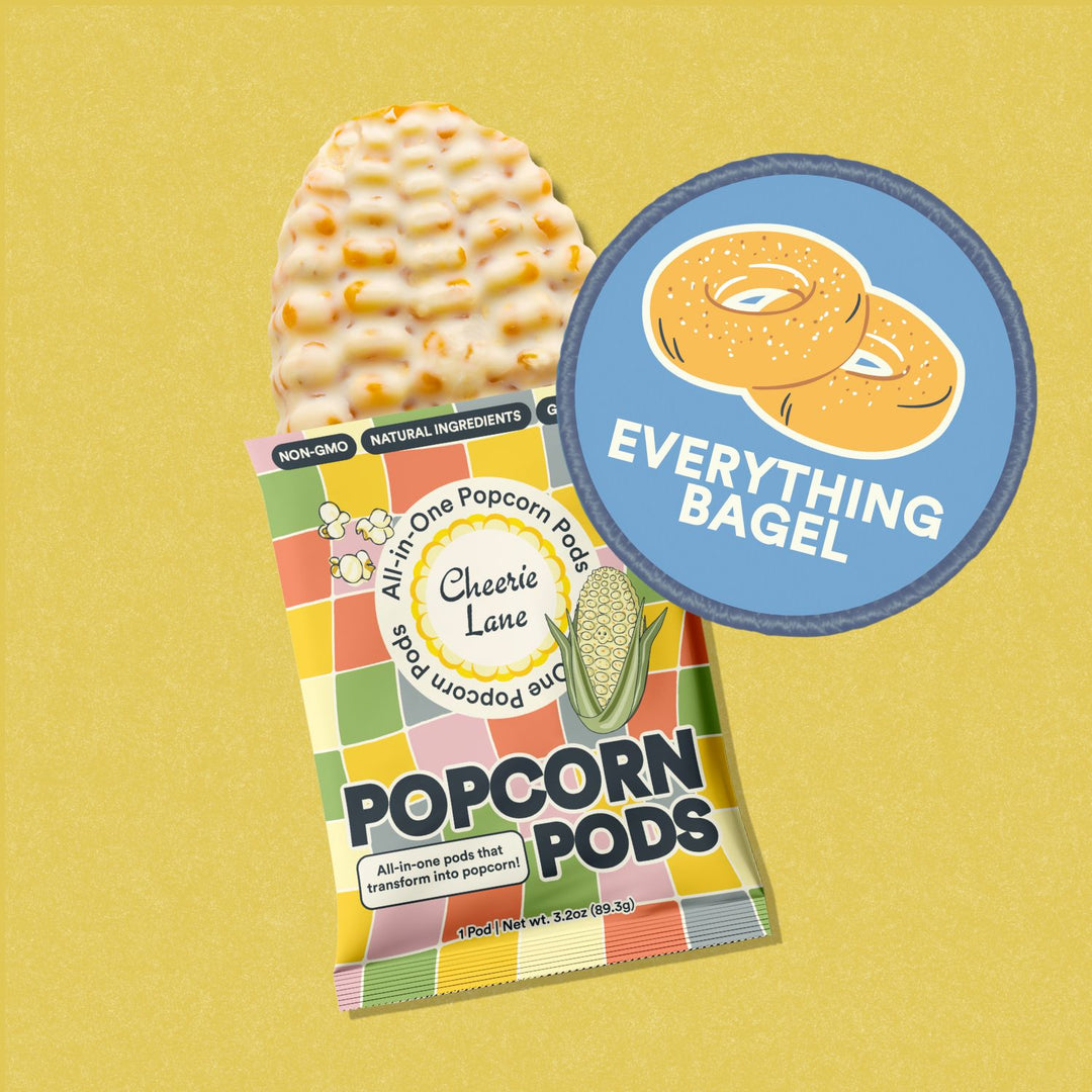 A package of Popcorn Pods with 'Everything Bagel' labeled on it, against a yellow background.