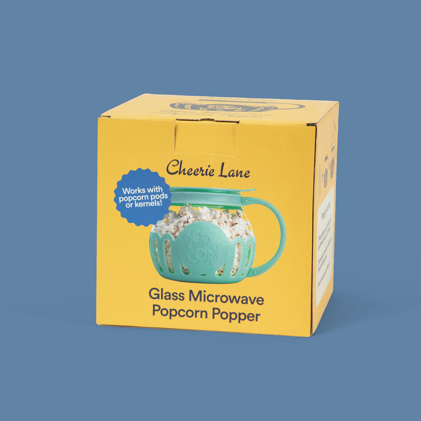 Yellow microwave popper box with photo of the teal round microwave popper with a handle on the front
