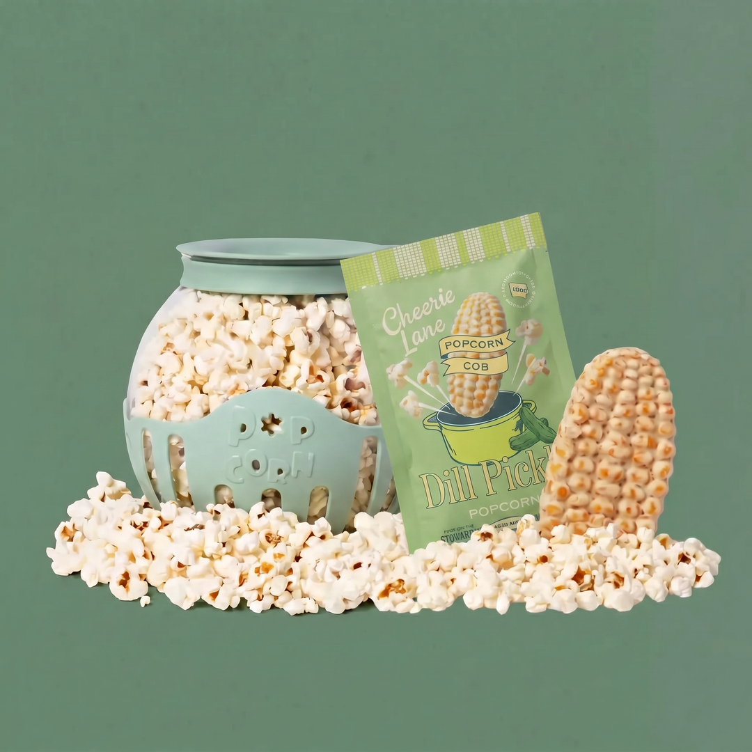 Popcorn in a teal container with a packet labeled 'Dill Pickle Popcorn' on a green background