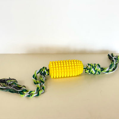 Yellow rubber corn cob dog toy with green rope